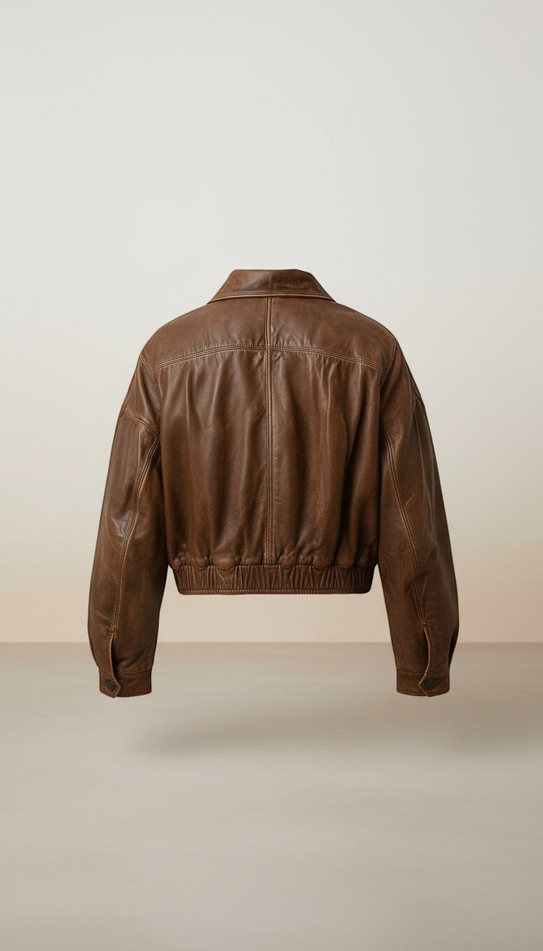 Scarlett Stitch distressed brown leather cropped bomber jacket with collar and elasticated hem.