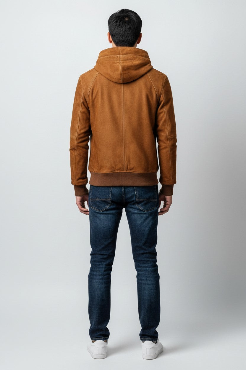Scarlett Stitch brown suede bomber jacket with hood, zip closure, and ribbed cuffs and hem. Worn by a man with jeans.