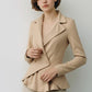 Scarlett Stitch beige double-breasted peplum blazer with lapel collar and asymmetrical wrap design.