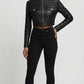 Scarlett Stitch black faux leather cropped moto jacket with diamond quilting on shoulders and zippered cuffs.