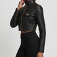 Scarlett Stitch black faux leather cropped moto jacket with diamond quilting on shoulders and ribbed sleeves.