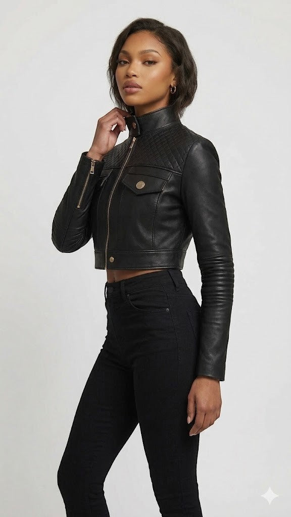 Scarlett Stitch black faux leather cropped moto jacket with diamond quilting on shoulders and ribbed sleeves.