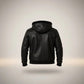 Scarlett Stitch Men's black faux leather hooded bomber jacket with sherpa lining and ribbed cuffs.