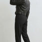 Scarlett Stitch black faux leather cropped moto jacket with faux shearling collar and cuffs, worn by a model.