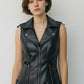 Scarlett Stitch black faux leather moto vest with lapel collar, zip front, zippered pockets, and buckle tabs.