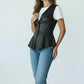 Scarlett Stitch black faux leather peplum vest with notched lapel and single-button closure. Sleeveless design.
