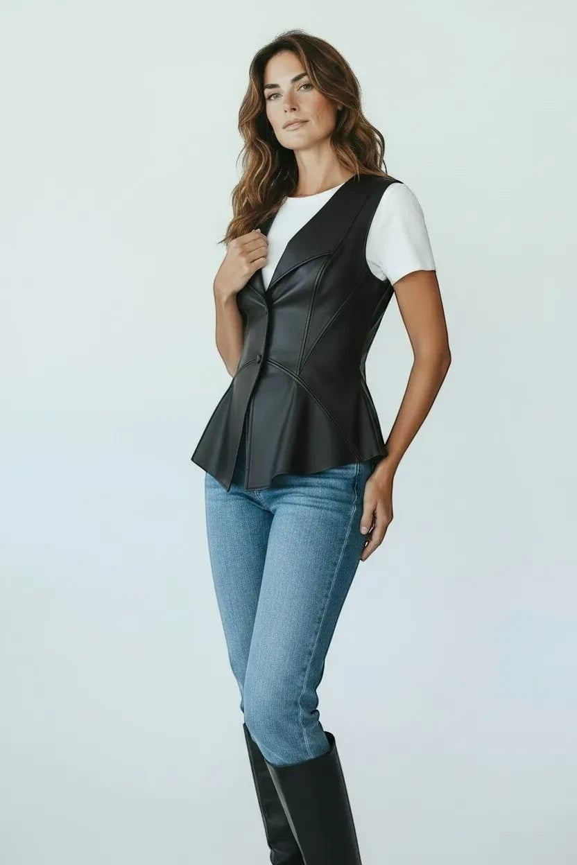 Scarlett Stitch black faux leather peplum vest with notched lapel and single-button closure. Sleeveless design.