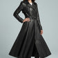 Scarlett Stitch black faux leather belted full skirt trench coat with wide lapels and double-breasted front.