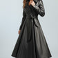 Scarlett Stitch black faux leather belted full skirt trench coat with wide lapels and double-breasted front.