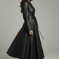 Scarlett Stitch black faux leather belted full skirt trench coat with wide lapels and button detailing.
