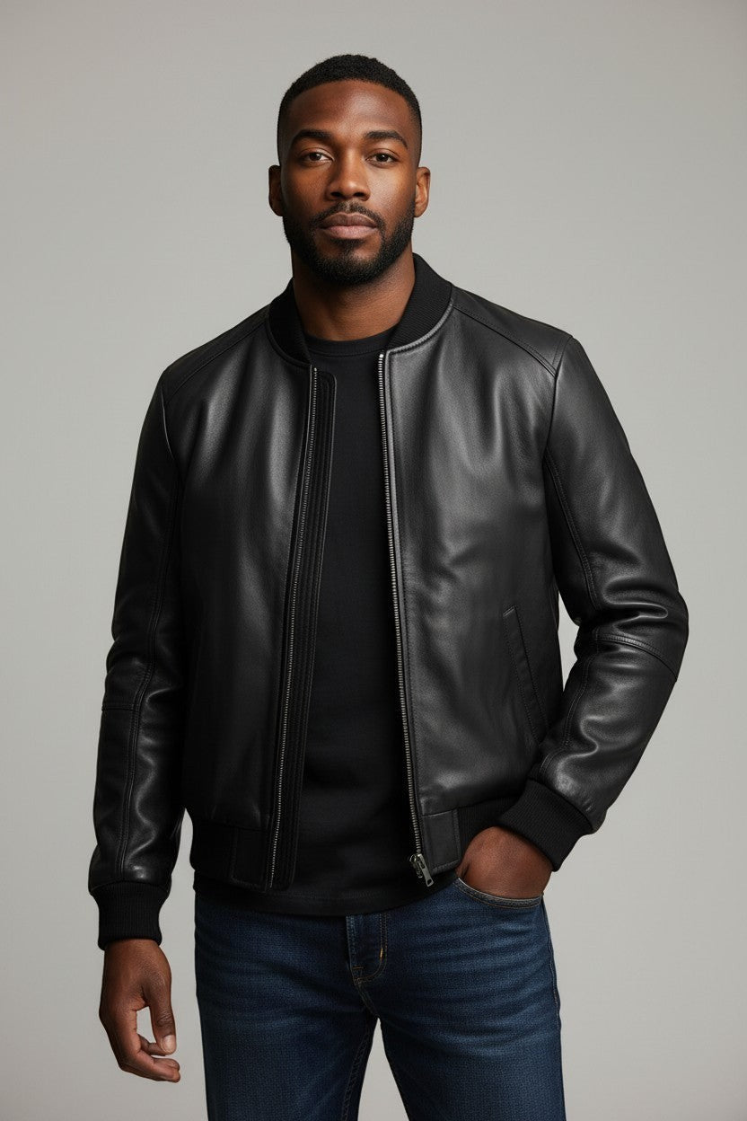 Scarlett Stitch men's black leather bomber jacket with ribbed collar, cuffs, and hem. Full zip front, side pockets.