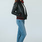 Scarlett Stitch women's black leather bomber jacket with red ribbed accents on collar, cuffs, and hem. Features zip front and pockets.