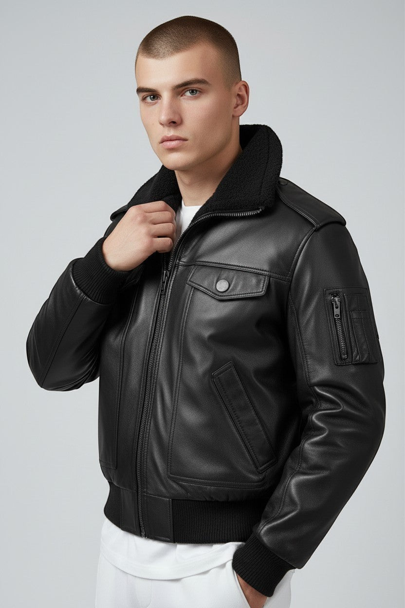 Scarlett Stitch black leather bomber jacket with detachable faux-shearling collar, utility sleeve pocket, and ribbed cuffs