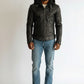Scarlett Stitch black leather hooded jacket with zipper pockets and cuffs, and a belted waist.