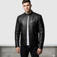 Scarlett Stitch men's black leather motorcycle jacket with quilted shoulder panels and mandarin collar on a model.