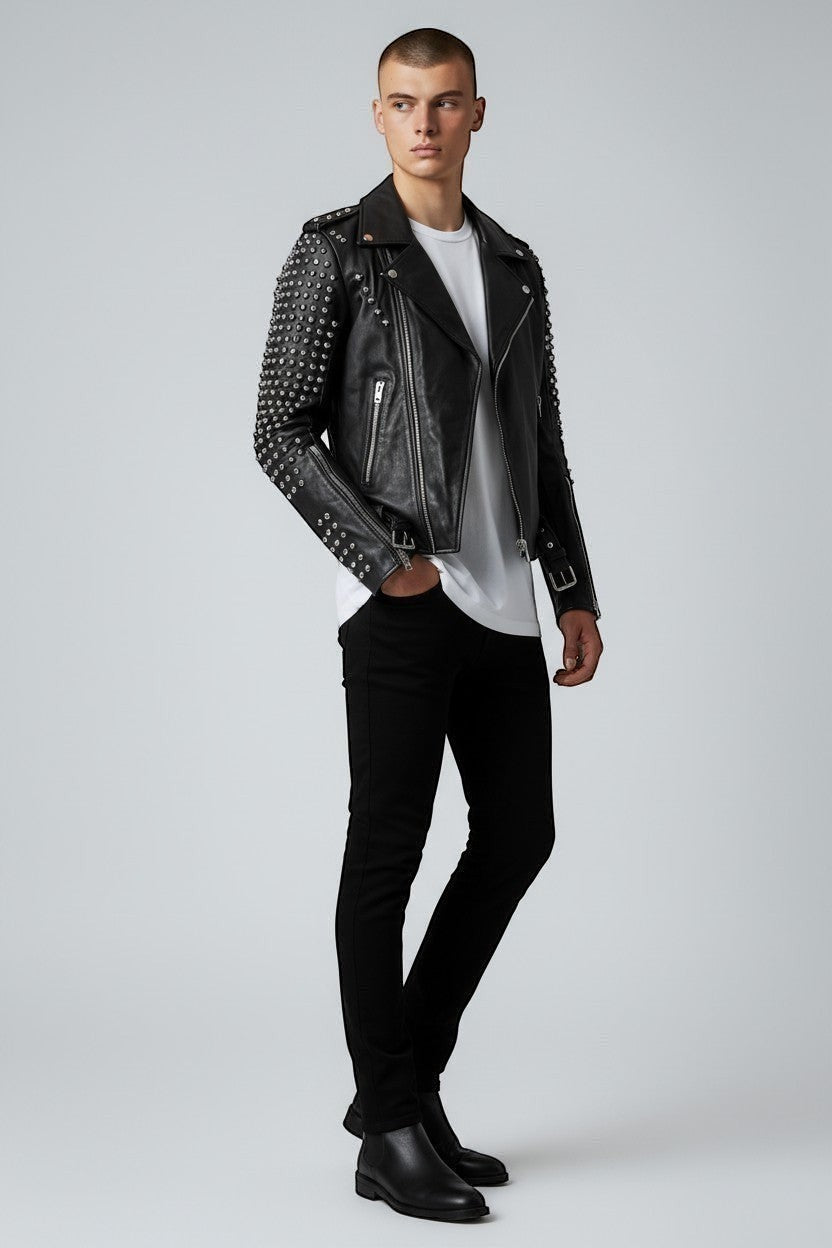 Scarlett Stitch black leather biker jacket with silver stud sleeves, asymmetrical zip, and belted waist on a model.