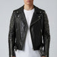 Scarlett Stitch black leather biker jacket with silver studs on sleeves, asymmetrical zip, and belted waist on a man.