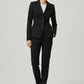 Scarlett Stitch women's black tailored blazer with notched lapel and three-button closure, paired with matching trousers.