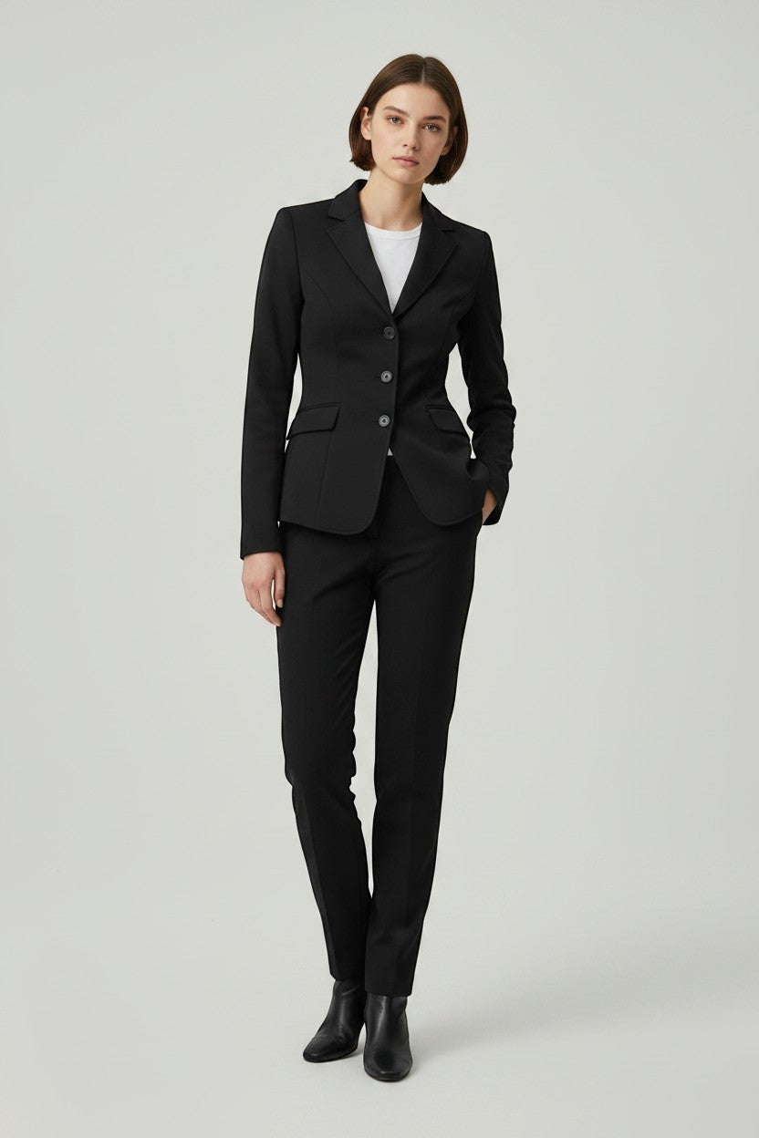 Scarlett Stitch women's black tailored blazer with notched lapel and three-button closure, paired with matching trousers.
