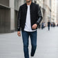 Scarlett Stitch Men's black wool-blend varsity jacket with genuine leather sleeves, snap-button front, and ribbed trim.