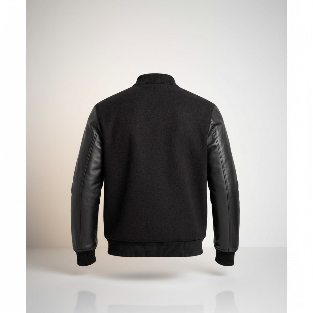 Scarlett Stitch Men's black wool-blend varsity jacket with genuine leather sleeves and ribbed trim.