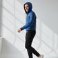 Scarlett Stitch blue faux leather bomber jacket with hood, quilted details, zip front, and ribbed cuffs/hem on a man.