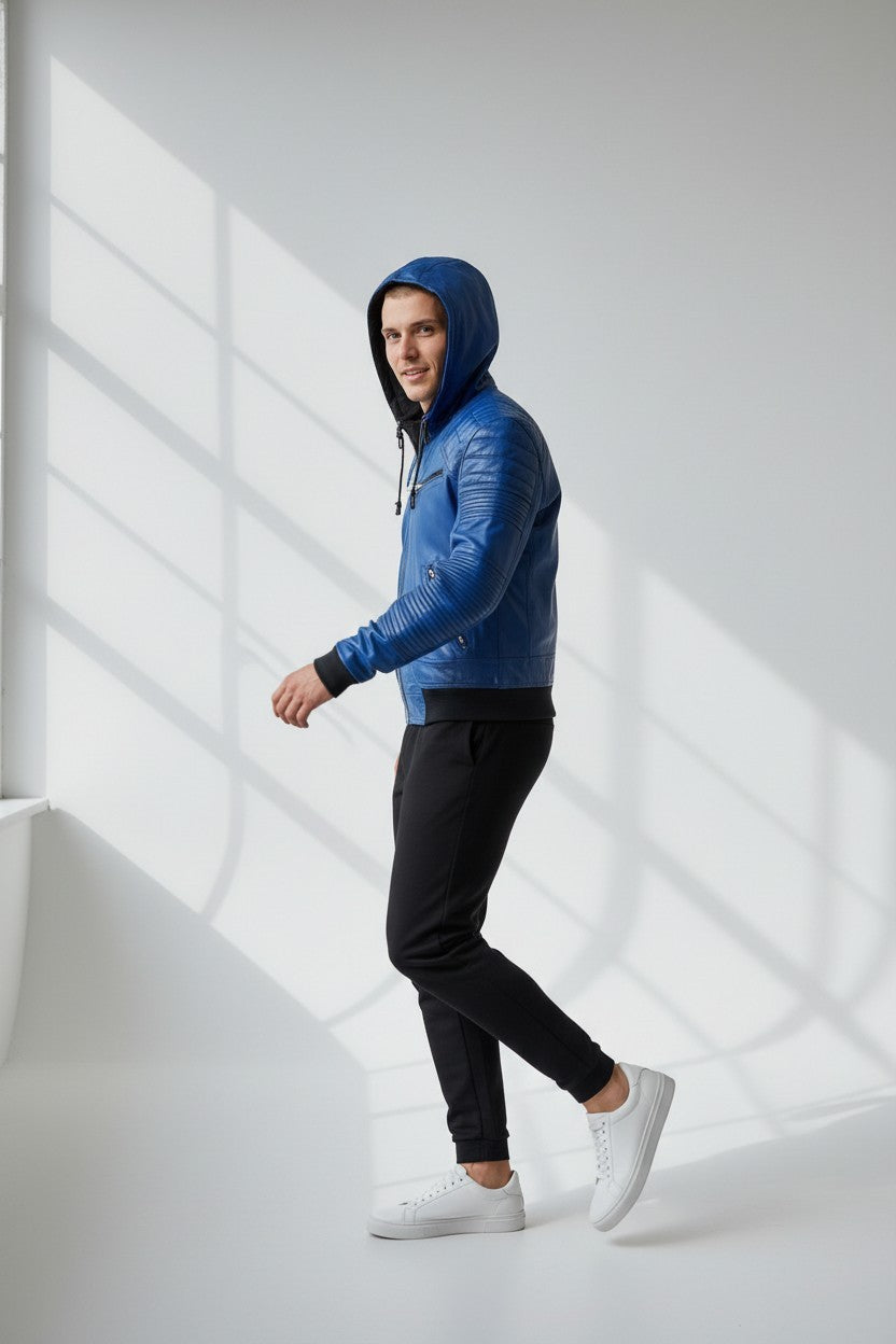 Scarlett Stitch blue faux leather bomber jacket with hood, quilted details, zip front, and ribbed cuffs/hem on a man.
