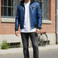 Scarlett Stitch blue faux leather hooded bomber jacket with quilted shoulder details and zip-front closure.