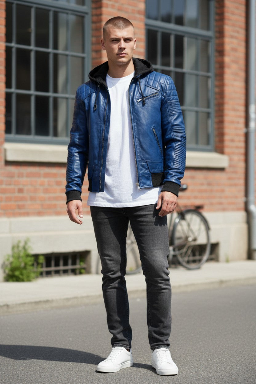 Scarlett Stitch blue faux leather hooded bomber jacket with quilted shoulder details and zip-front closure.