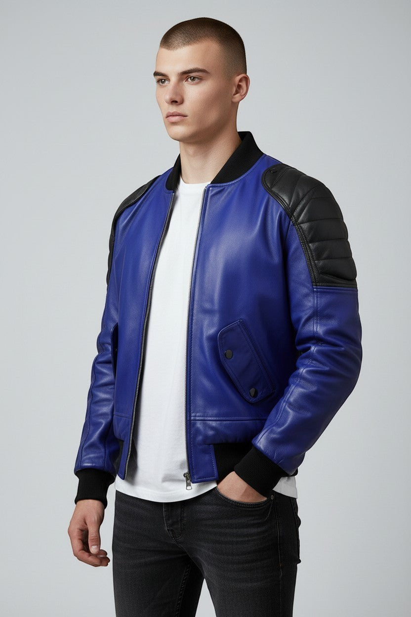Scarlett Stitch men's royal blue genuine leather bomber jacket with black quilted shoulders and ribbed cuffs.