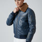 Scarlett Stitch men's blue leather bomber jacket with a brown faux-fur collar, ribbed cuffs, and zippered sleeve pocket.