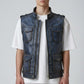 Model wearing a Scarlett Stitch distressed blue leather utility vest with multiple pockets and a stand-up collar.