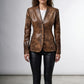 Scarlett Stitch brown distressed leather blazer with notched lapels and four-button closure on a female model.