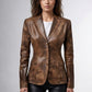 Scarlett Stitch brown distressed leather blazer with notched lapels and four-button closure worn by a model