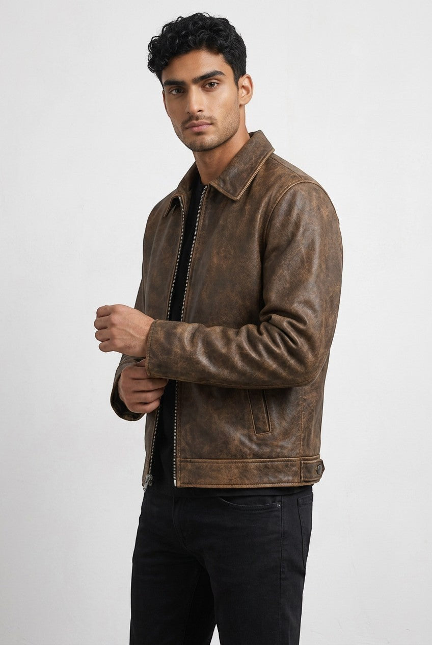 Scarlett Stitch men's brown distressed leather bomber jacket with a structured collar and front zipper.