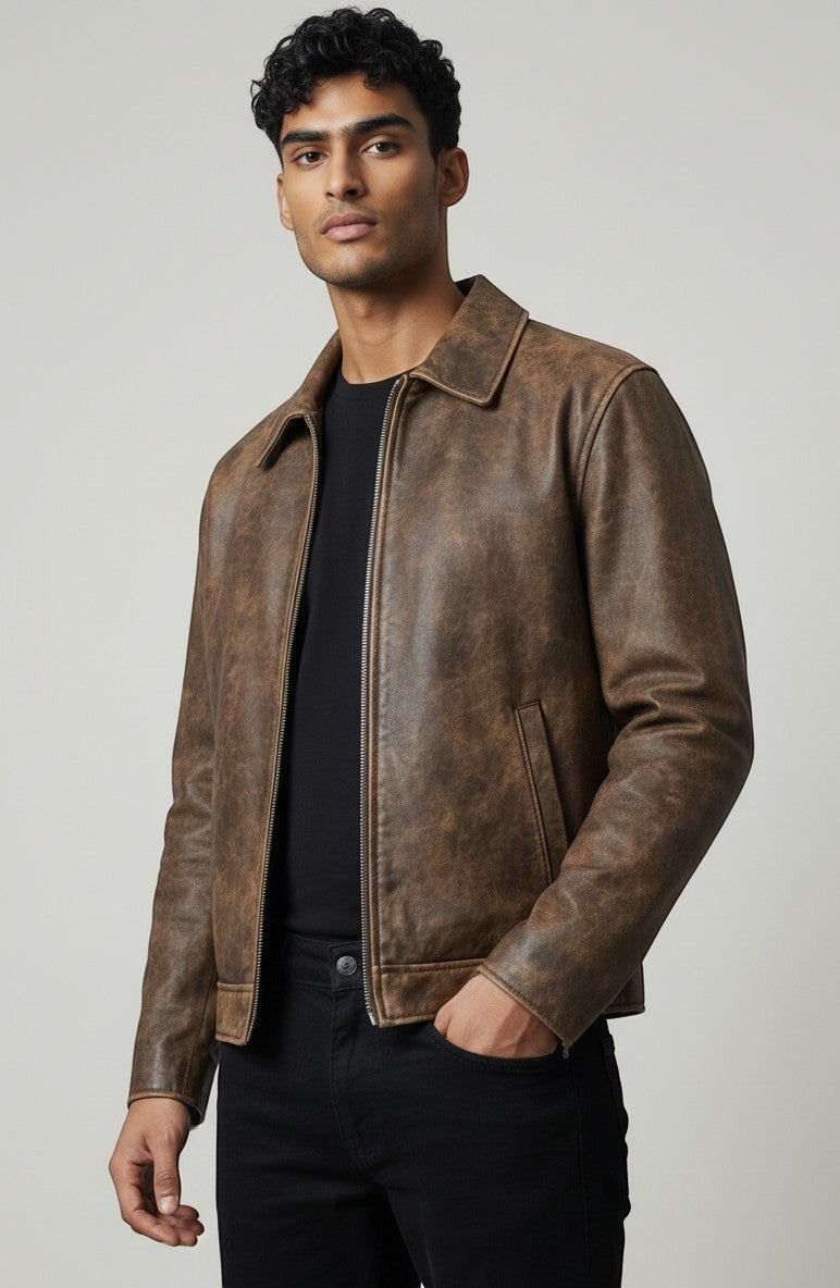 Scarlett Stitch men's brown distressed leather bomber jacket with a structured collar and front zipper.