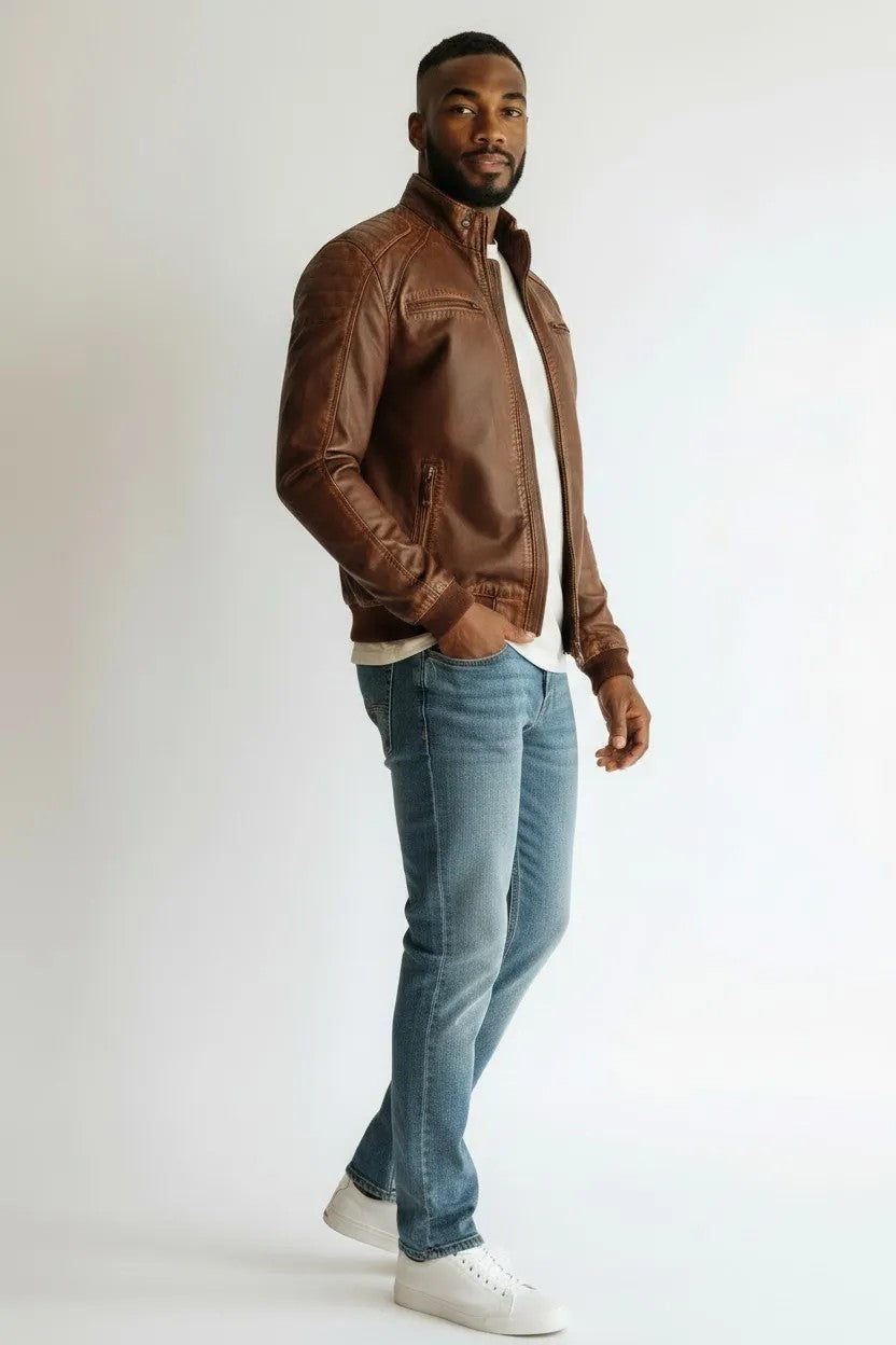 Scarlett Stitch Men's brown faux leather bomber jacket with stand-up collar, zip front, and quilted shoulders.
