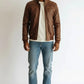 Scarlett Stitch men's brown faux leather bomber jacket with stand-up collar, zip front, and quilted shoulder panels.