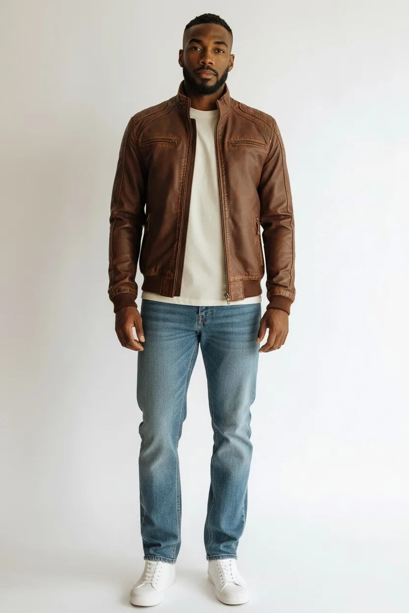 Scarlett Stitch men's brown faux leather bomber jacket with stand-up collar, zip front, and quilted shoulder panels.