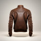 Scarlett Stitch brown faux leather bomber jacket with stand collar, ribbed cuffs and hem, and detailed stitching.