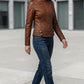 Scarlett Stitch brown faux leather moto jacket with zipper details, stand-up collar, and snap buttons.