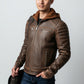 Scarlett Stitch men's brown leather jacket with a soft hooded insert, quilted shoulders, and silver-tone hardware.