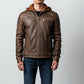 Scarlett Stitch men's brown leather jacket with a hooded insert, quilted shoulder panels, and silver-tone zippers.
