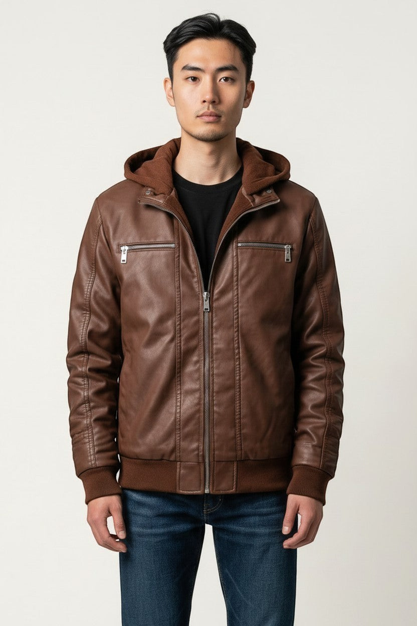 Scarlett Stitch men's brown faux leather hooded jacket with ribbed cuffs and silver zippers worn by a model.