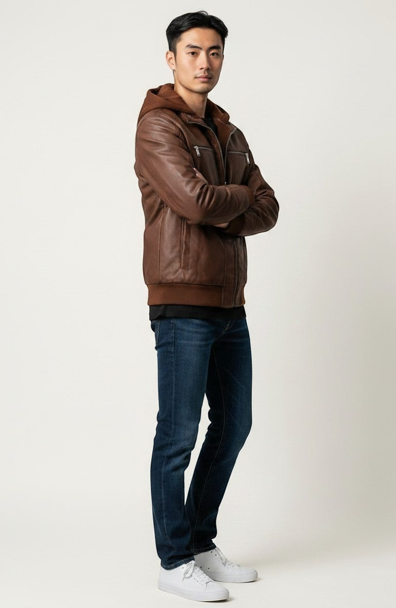 Scarlett Stitch men's brown faux leather hooded jacket with ribbed cuffs and silver zippers worn by a male model.