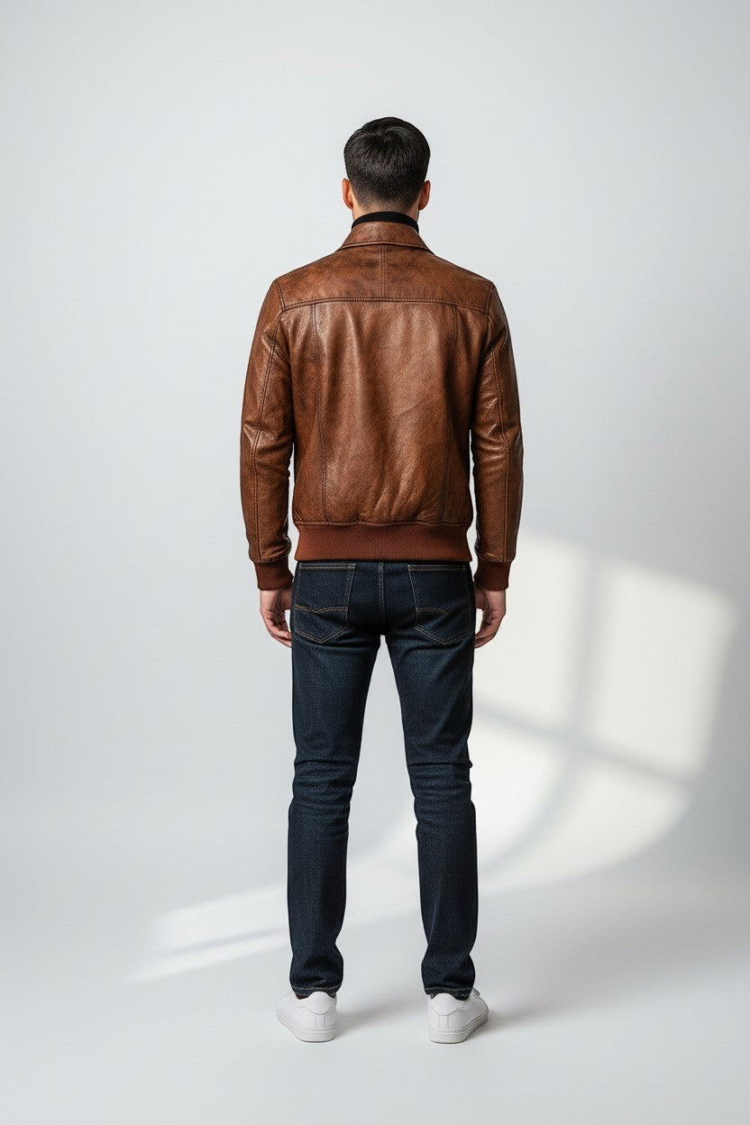 Scarlett Stitch men's distressed brown genuine leather bomber jacket with ribbed collar, cuffs, and hem.