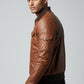 Scarlett Stitch Men's brown quilted faux leather bomber jacket with ribbed collar, cuffs, and hem.