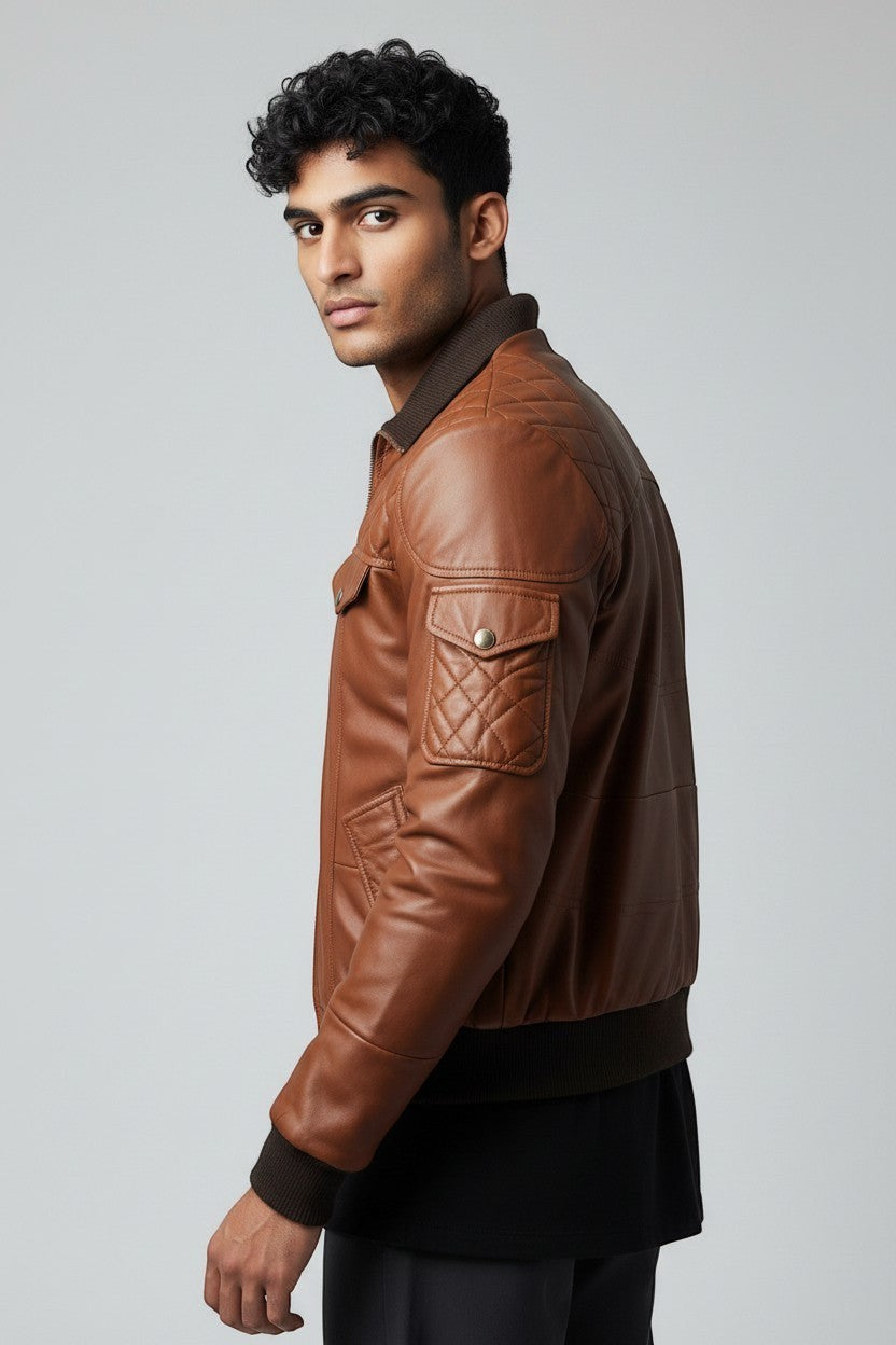 Scarlett Stitch Men's brown quilted faux leather bomber jacket with ribbed collar, cuffs, and hem.