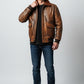 Scarlett Stitch Men's distressed brown faux leather bomber jacket with shearling collar and ribbed cuffs.