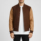 Scarlett Stitch Men's brown wool-blend varsity bomber jacket with tan leather sleeves, ribbed collar, cuffs, and hem.
